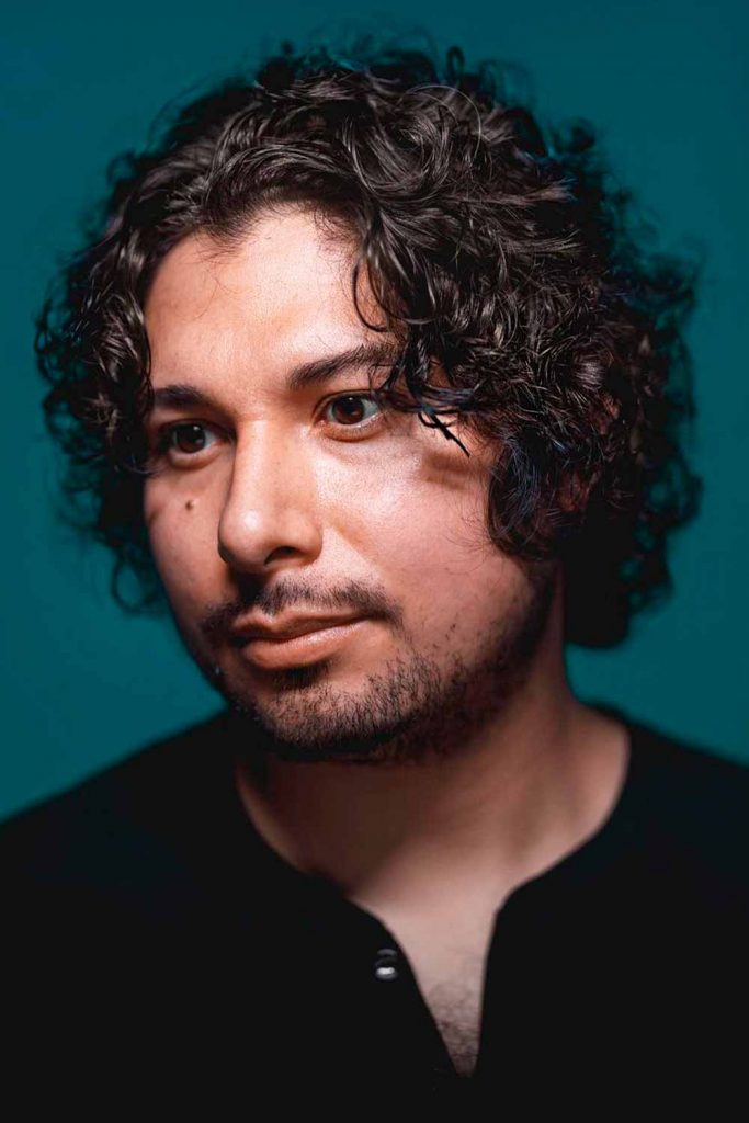 Medium Length Curly Low Maintenance Mens Hairstyles #curlyhairmen #curlyhairstylesformen #menwithcurlyhair